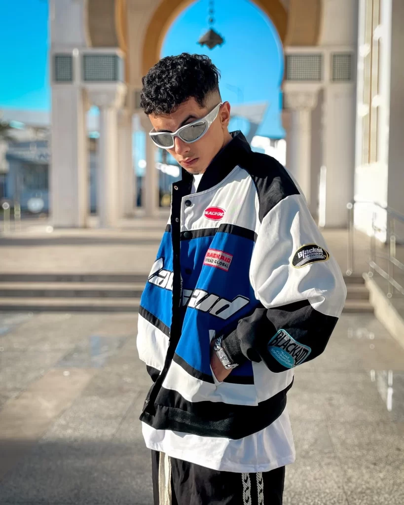Graphic t shirt layered with a lightweight jacket for a streetwear outfit